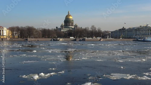 View of St. Isaac's Cathedral and the ice drift on the Neva River on an April day. Saint Petersburg, Russia