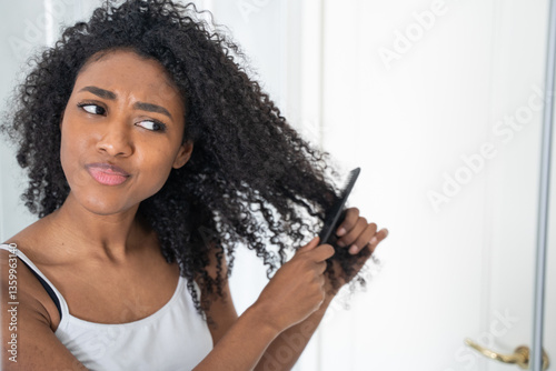 One black woman worried about her curly hair