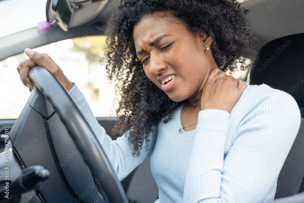 A black woman hurts her neck after a car accident A black woman hurts her neck after a car accident