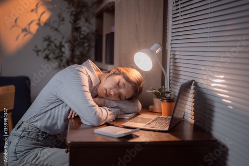 Papier peint Young Asian office worker sleeping on desk at night after working late with lapt