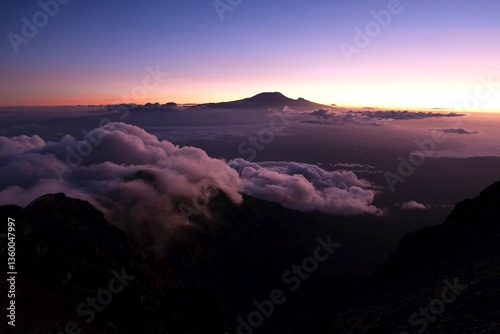 Obraz na płótnie View of Kilimanjaro at sunrise while trekking Mount Meru, a volcano in Tanzania. Arusha National Park w salonie