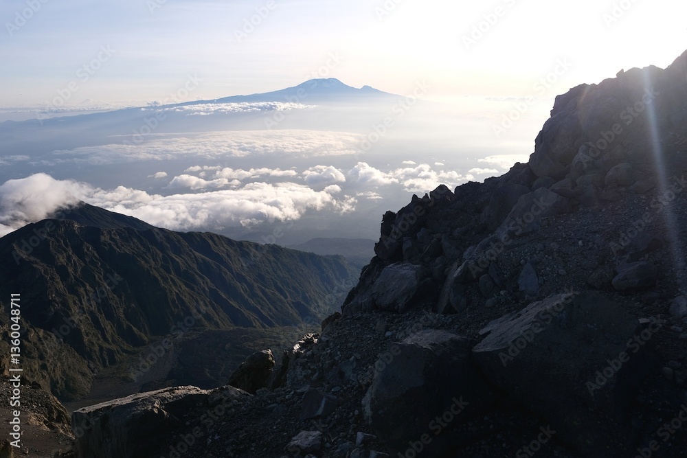 View of Kilimanjaro at sunrise while trekking Mount Meru, a volcano in Tanzania. Arusha National Park