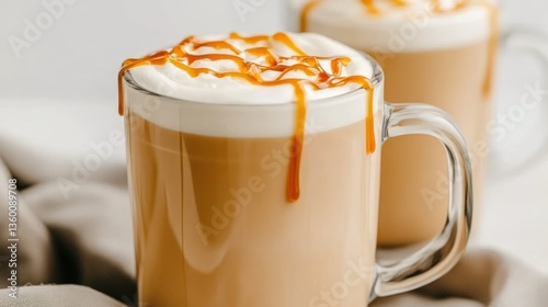 Caramel Latte in Glass Mug on Fabric Background photo