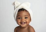 Happy Cute Baby with Towel on Head Smiling Showing Teeth Isolated on White Background