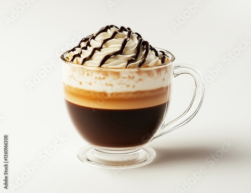 Close up of coffee in clear glass mug topped with whipped cream and chocolate sauce.