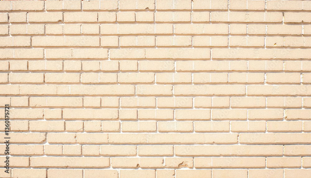 Obraz premium Textured beige brick wall background for design projects 