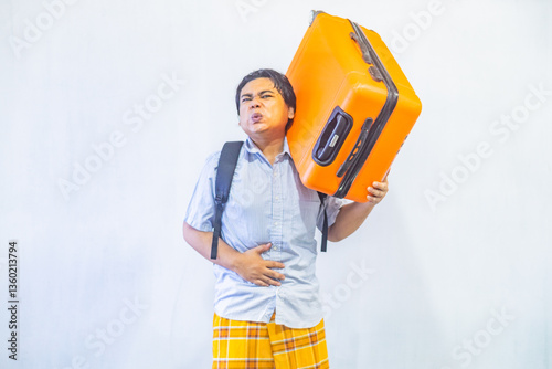Obraz na płótnie Portrait Asian muslim man carrying suitcase . Concept Going home for Eid Mubarak. Isolated image on white background w salonie