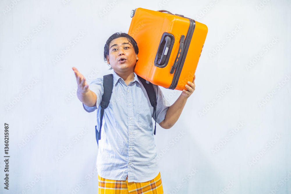 Portrait Asian muslim man carrying suitcase . Concept Going home for Eid Mubarak. Isolated image on white background