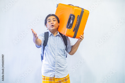 Obraz na płótnie Portrait Asian muslim man carrying suitcase . Concept Going home for Eid Mubarak. Isolated image on white background w salonie