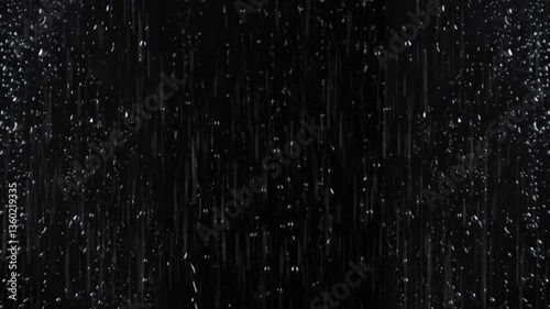 Video of heavy rain falling on black background