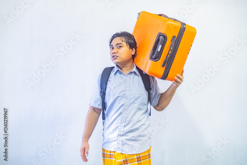 Obraz na płótnie Portrait Asian muslim man carrying suitcase . Concept Going home for Eid Mubarak. Isolated image on white background w salonie