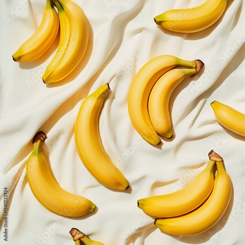Bunch of fresh bananas on soft fabric food photography bright and inviting top-down view tropical vibes