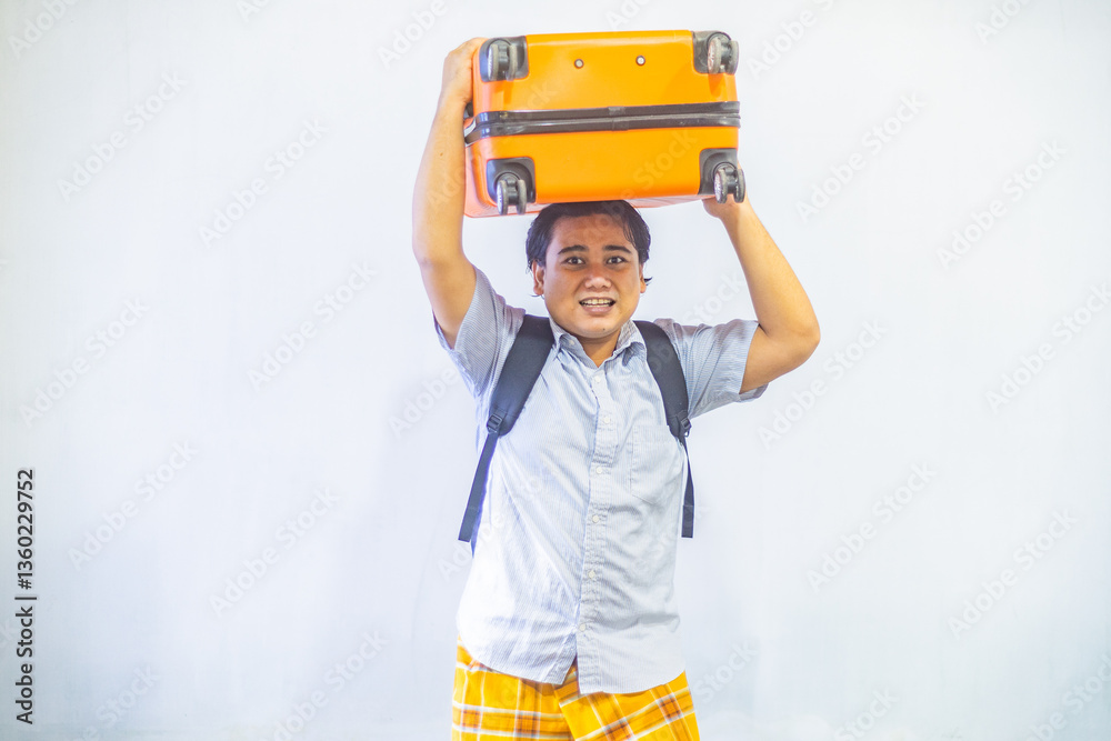 Portrait Asian muslim man carrying suitcase . Concept Going home for Eid Mubarak. Isolated image on white background