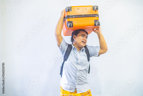Obraz na płótnie Portrait Asian muslim man carrying suitcase . Concept Going home for Eid Mubarak. Isolated image on white background w salonie