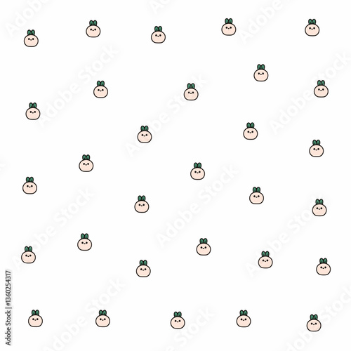 a pattern of a face with a green bow