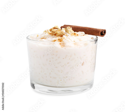 Tasty rice pudding with cinnamon and nuts in glass bowl isolated on white