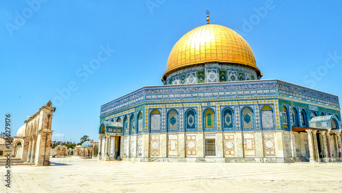 The Golden Dome of the Rock in Jerusalem, Israel – intricate Islamic architecture and vibrant mosaics under clear blue sky. One of the world’s landmark buildings and travel destinations.