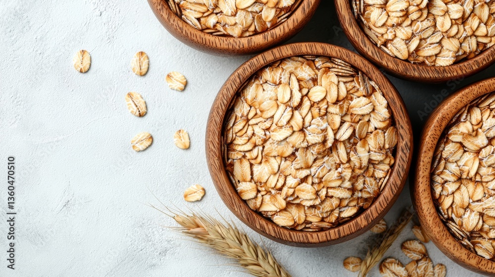 three wooden bowls filled with oats on top of a table three wooden bowls filled with oats on top of a table