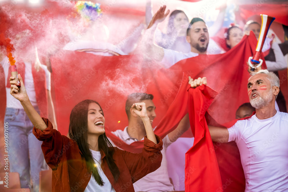 Sport fans lit torches in the stadium at the game. Red colors, flags, stadium. Sport fans lit torches in the stadium at the game. Red colors, flags, stadium.