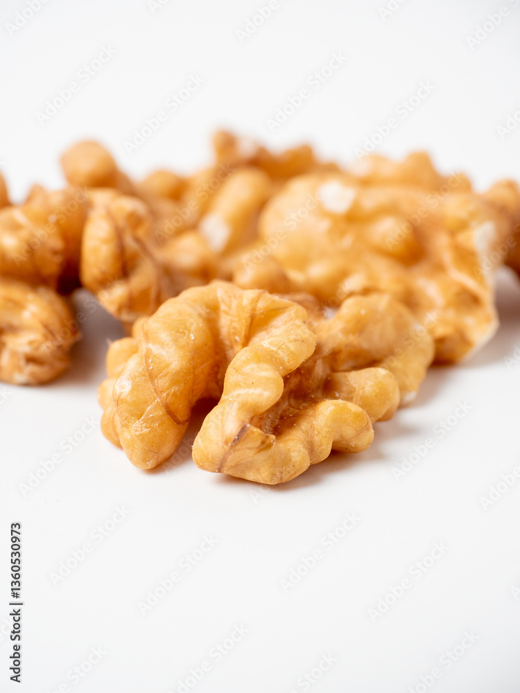 close-up of shelled walnuts on a white background. Food that's good for your mind, blurred background close-up of shelled walnuts on a white background. Food that's good for your mind, blurred background