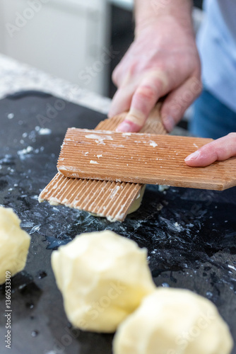 Wooden butter paddles shaping fresh butter portions