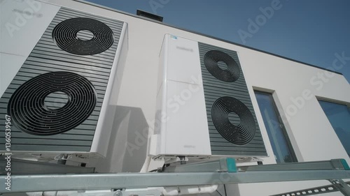 Outdoor heat pump units installed on modern building wall