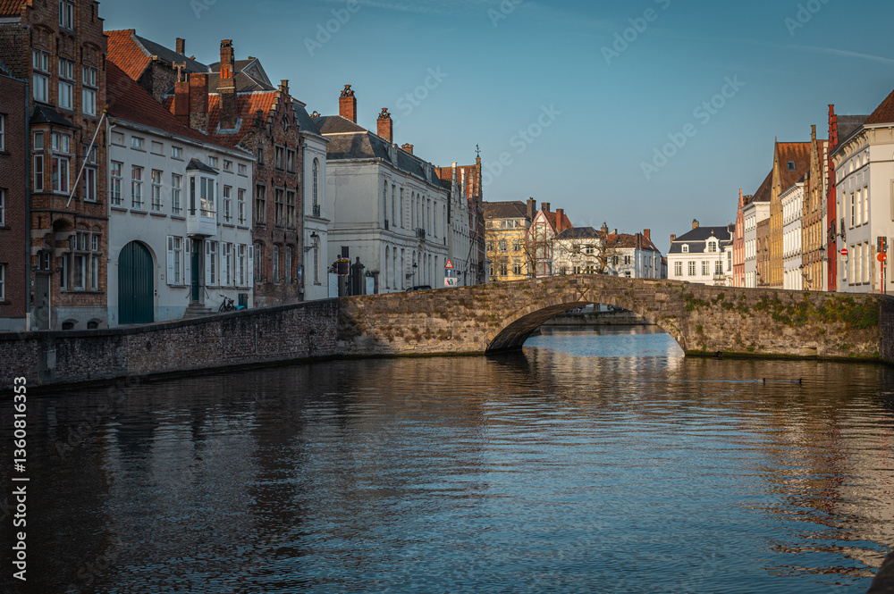 Fototapeta premium Bruges Canals Reflecting Historic Architecture at Sunset