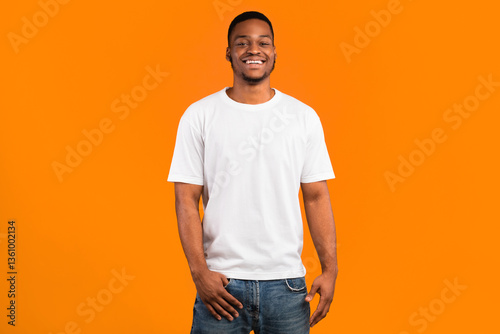 Bild auf Leinwand Happy Black Man Smiling To Camera Posing Standing Over Yellow Background, Studio Shot