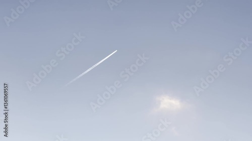 blue sky with airplane causing chemtrails