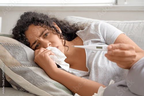 Sick African-American woman...