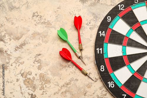 Dartboard with darts on bei...