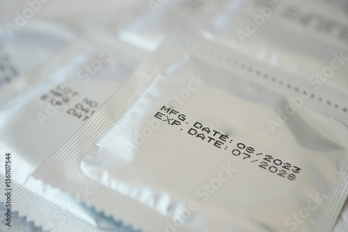 Bild auf Leinwand Packaged condoms with manufacturing and expiration dates shown clearly