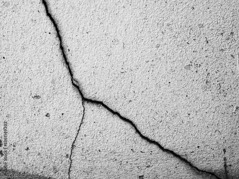 Obraz premium Crack wall texture background broken earthquake effect, whtie grey building cement damage pattern plaster grunge black line paint surface abstract, construction rough street concrete backdrop.