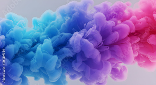 A mesmerizing abstract scene of colorful ink swirling in water, forming delicate cloud-like formations. The colors transition smoothly from soft blue to vibrant purple and rich pink.