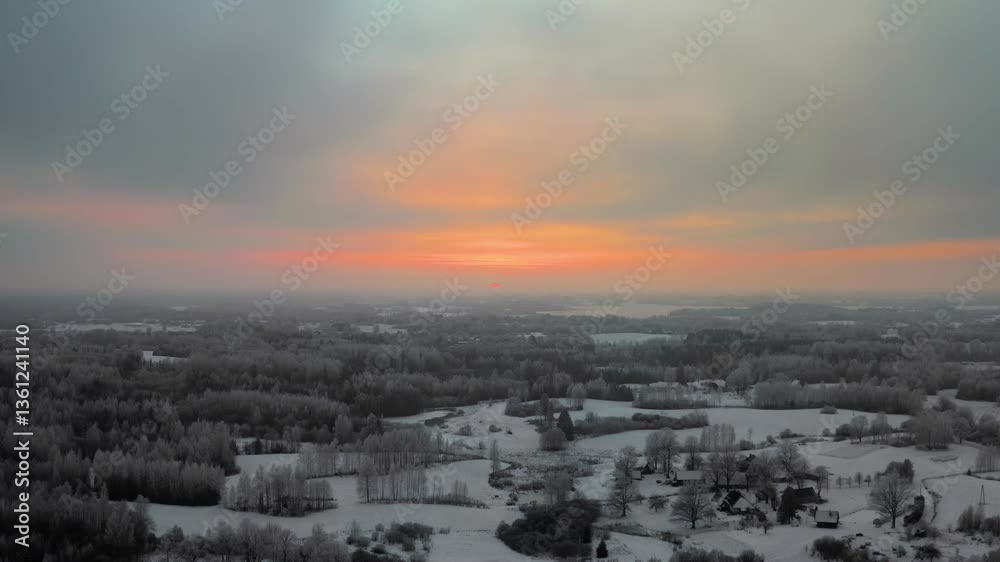 Aerial drone view of a stunning frozen forest at sunset. Breathtaking winter landscape with snow-covered trees in the countryside with vibrant, colorful and cold winter evening. Aerial drone view of a stunning frozen forest at sunset. Breathtaking winter landscape with snow-covered trees in the countryside with vibrant, colorful and cold winter evening.