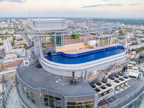 Aerial view of the Yekaterinburg city center with Vysotsky skyscraper. Beautiful landscape of a high-rise building with a rooftop pool and glass facade in Russia