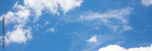 blue sky and fantastic soft white clouds ,  horizontal shape with space for design. Web banner. Wide. Panoramic. Website header