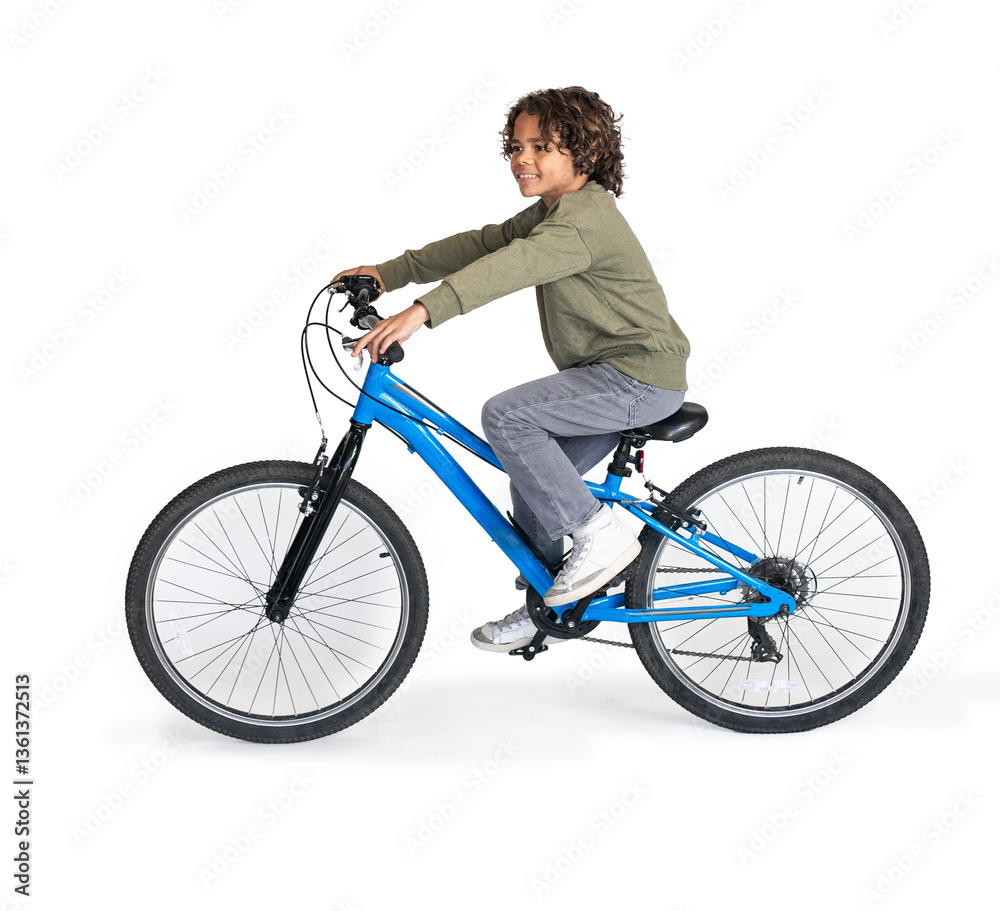Fototapeta premium Cute diverse boy riding a bike isolated on a white background. Child going to school or riding through the neighborhood 