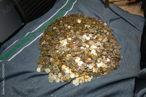Obraz na płótnie a lot of euro coins lie unsorted on a blanket w salonie