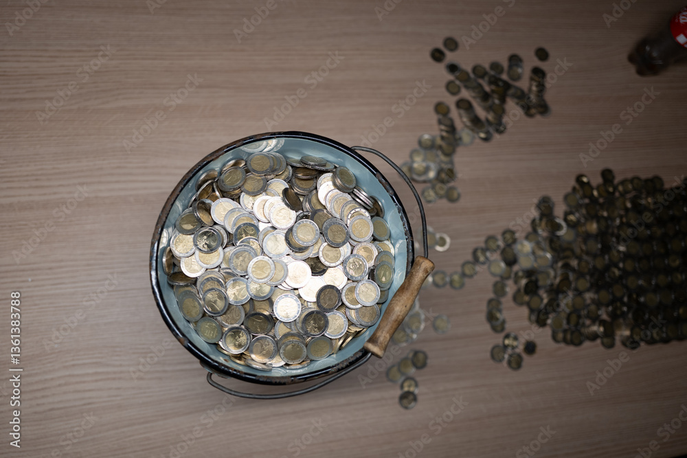 a bucket is filled with a lot of euro coins