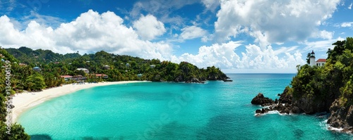Obraz na płótnie Serene Tropical Beach with Clear Water and Lush Green Landscape w salonie