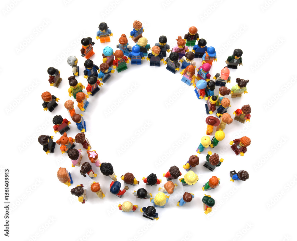 Naklejka premium Many lego minifigures in challenge group in circle top view or above isolated on white. Editorial illustrative image of popular children plastic constructor with studs.