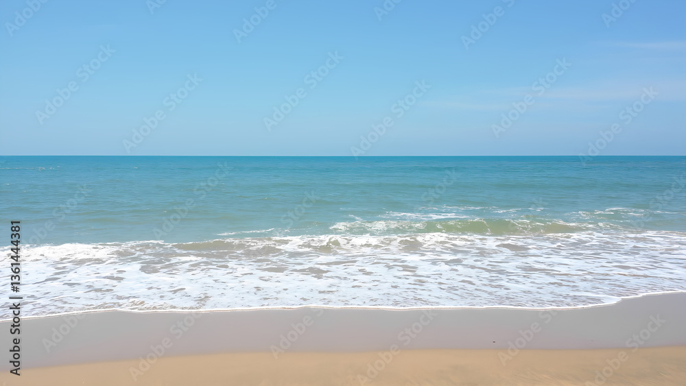 Waves on the beach as a background. Beautiful natural background at the summer time Waves on the beach as a background. Beautiful natural background at the summer time