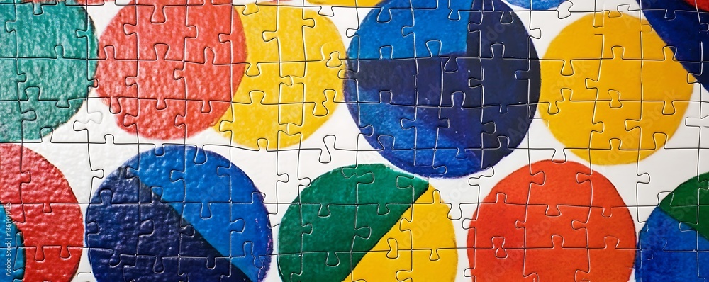 Obraz premium Vibrant sliding puzzle with bold primary colors on white background