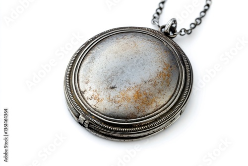 Antique tarnished silver locket pendant on chain, showing age and wear.