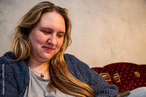 Mother enjoying a quiet moment of reflection in a cozy, inviting living space