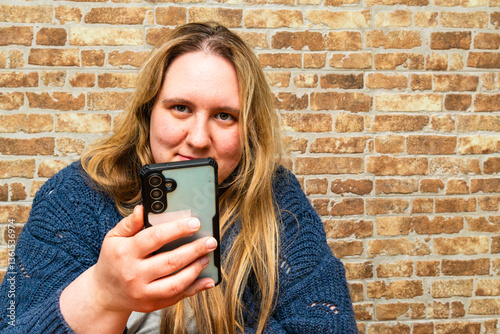 Capturing a moment of joy with a smartphone in a cozy setting