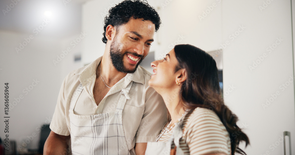 Obraz premium Home, cooking and couple in kitchen, funny and bonding together with apron, romance and marriage. People, relationship and man with woman, happiness and healthy meal with smile, lunch and love
