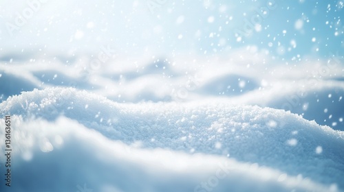 A snowy hillside with a blue sky in the background. The snow is white and fluffy, and the hill is covered in it. The scene is peaceful and serene, with the snow creating a sense of calm