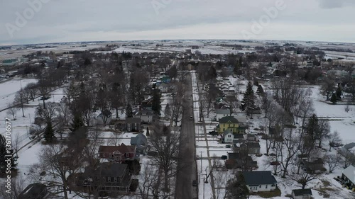 4K Aerial View of West Liberty, Iowa, Featuring the Water Tower in a Winter Landscape
